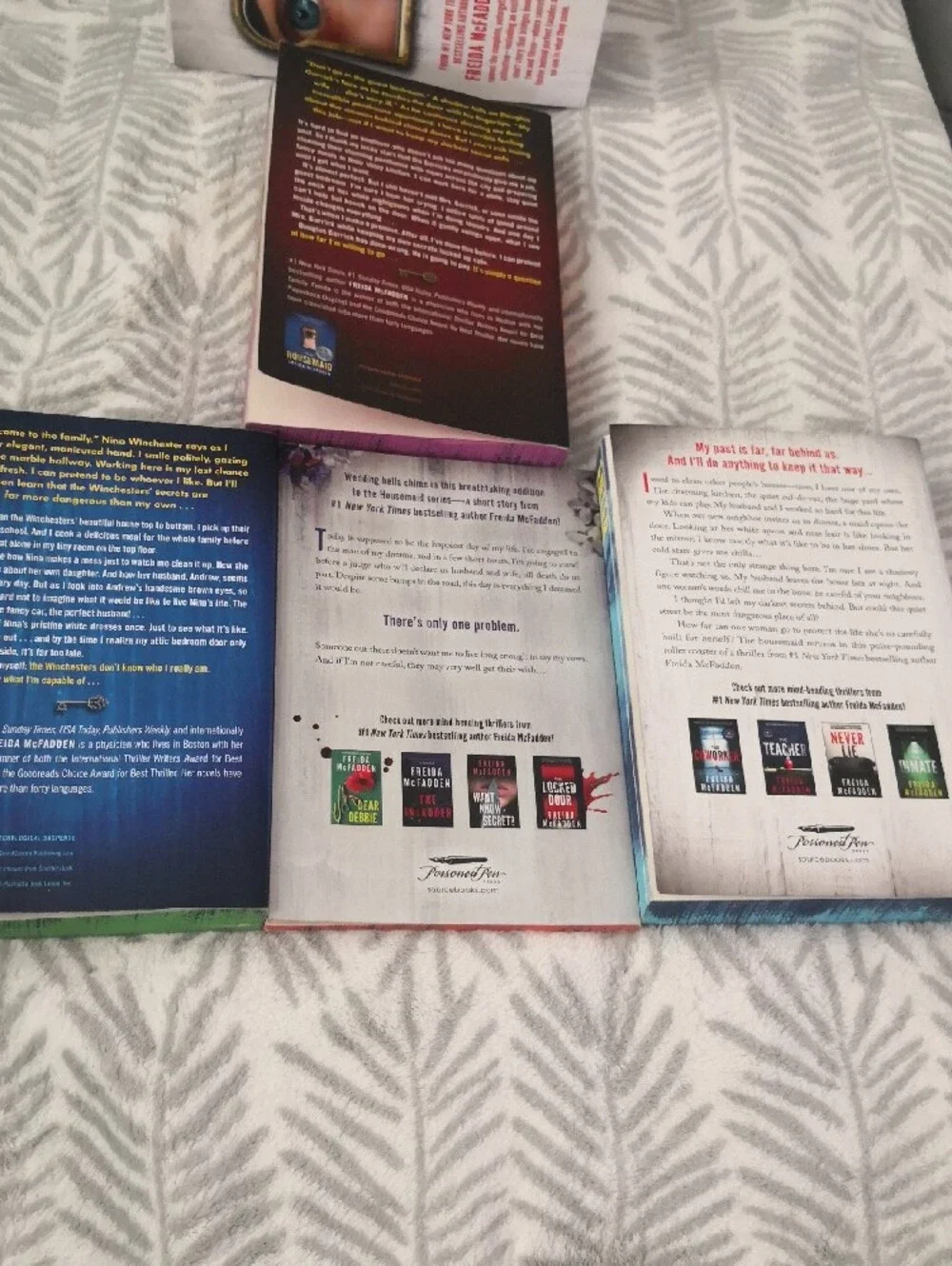 Designed edges that spell ENTER THE TWISTED WORLD OF THE HOUSEMAID when the book